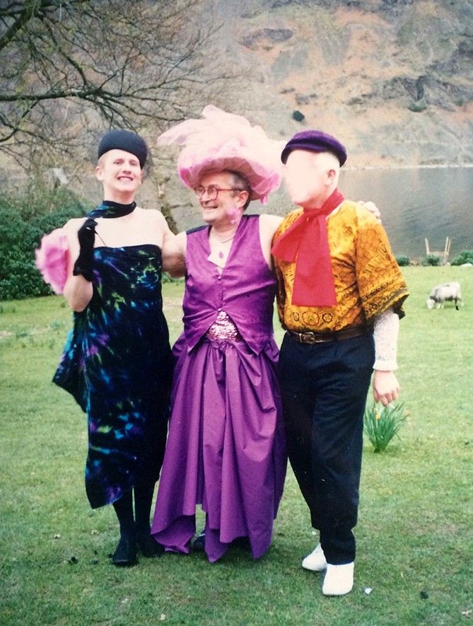 Jon in a purple dress and hat